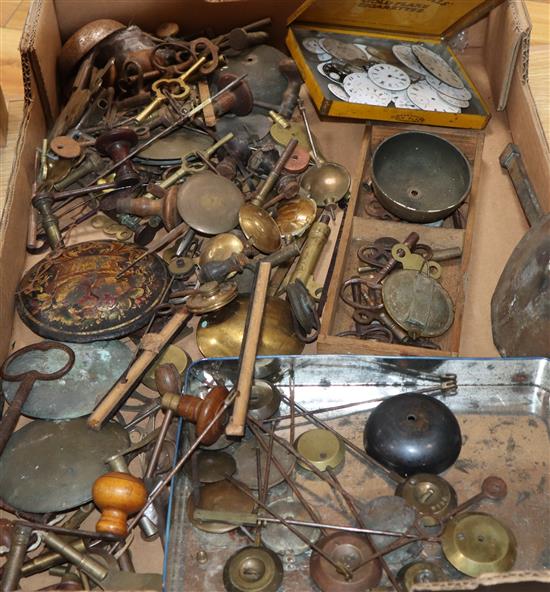 A quantity of clock keys, pendulums and pocket watch dials